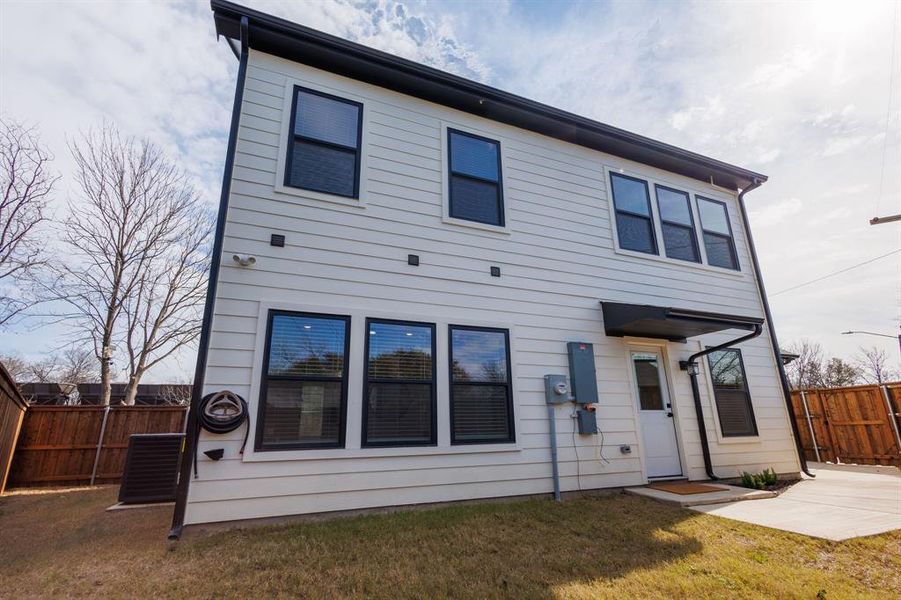 Rear view of property featuring a patio and a yard Rear view of property featuring a patio and a yard