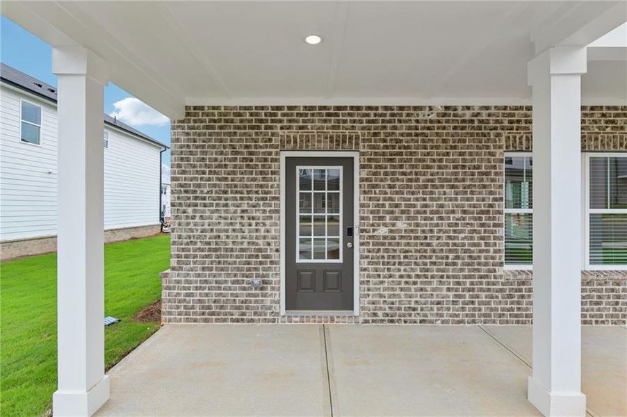 Exterior details and patio area of a home in Martin Springs - Cottage Series, Lawrenceville (Image 4).