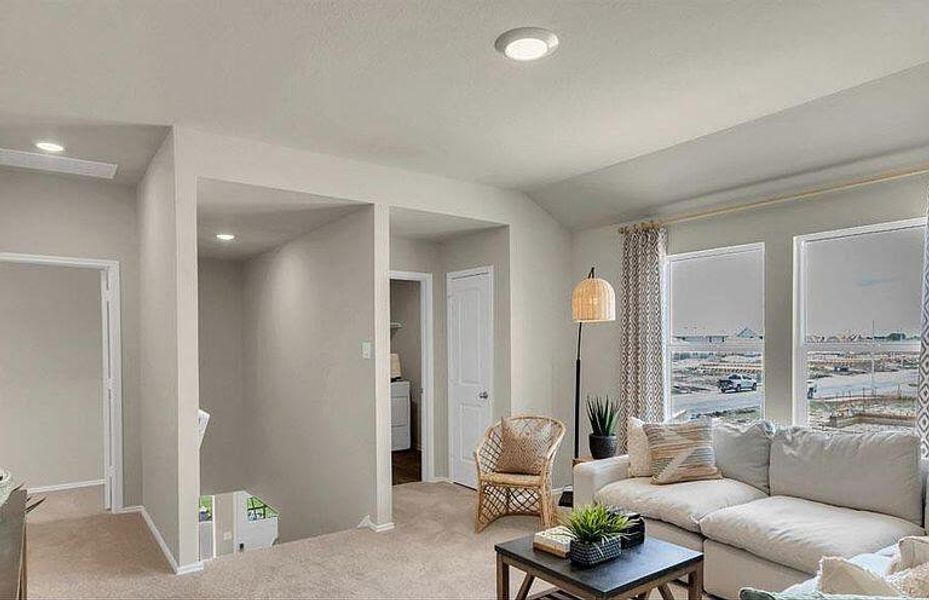 Carpeted living area with baseboards and recessed lighting Carpeted living area with baseboards and recessed lighting