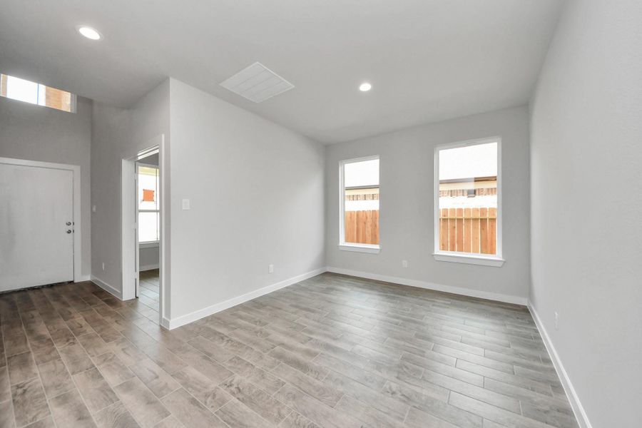 An inviting dining space seamlessly woven into the open concept, connecting the family room and kitchen. An inviting dining space seamlessly woven into the open concept, connecting the family room and kitchen.