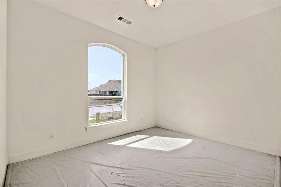 Unfurnished room with baseboards