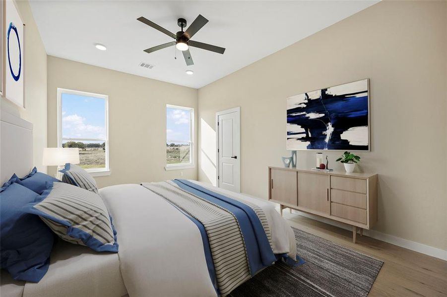 Bedroom featuring ceiling fan and light wood-type flooring