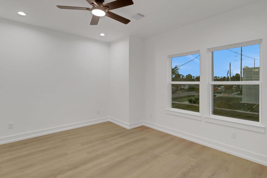 Another secondary bedroom with dual windows and modern ceiling fan for added comfort. Another secondary bedroom with dual windows and modern ceiling fan for added comfort.