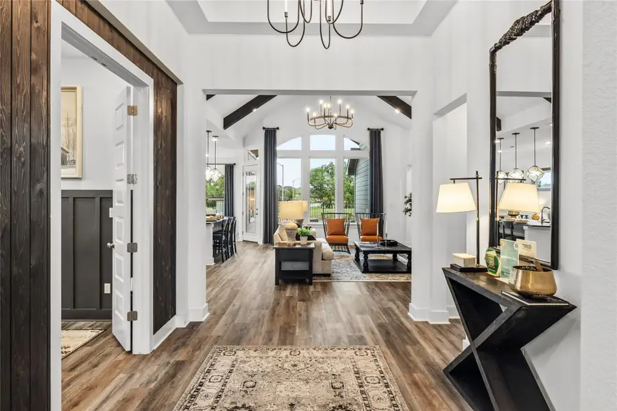 Foyer featuring a chandelier and wood finished floors