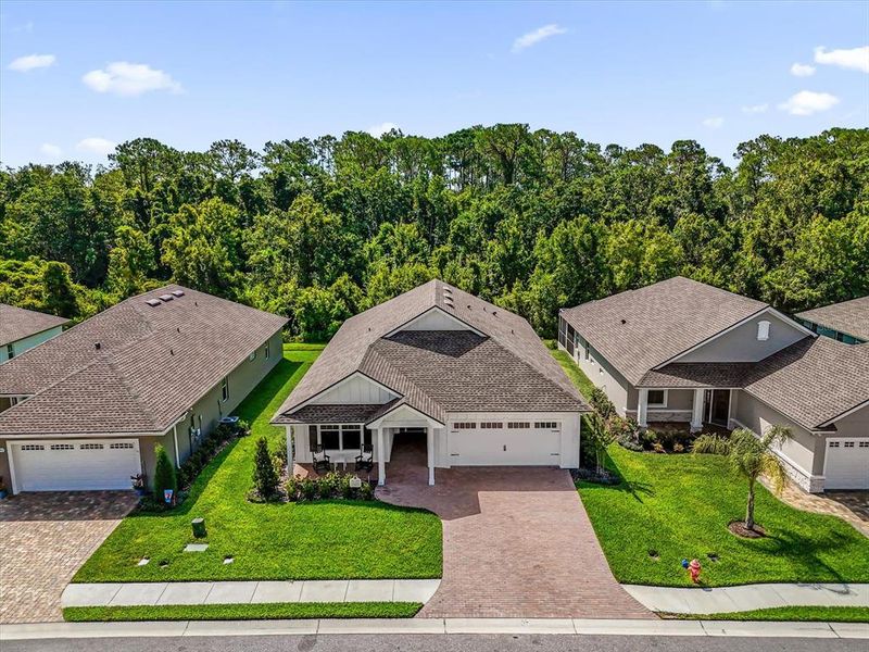 Front exterior of a new home in Lake James, Lakeland, FL, highlighting curb appeal (Image 2). Front exterior of a new home in Lake James, Lakeland, FL, highlighting curb appeal (Image 2).