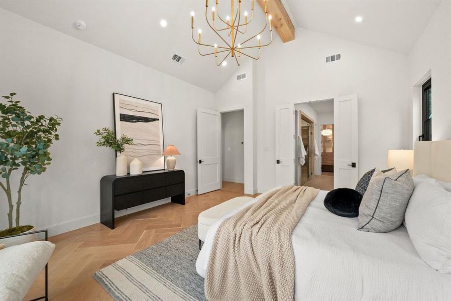 Bedroom with a chandelier, parquet floors, beamed ceiling, high vaulted ceiling, and a walk in closet Bedroom with a chandelier, parquet floors, beamed ceiling, high vaulted ceiling, and a walk in closet