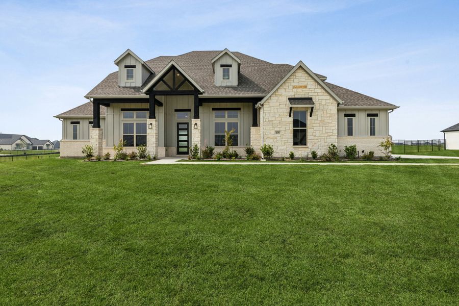 Front exterior of a new home in Heritage, McLendon-Chisholm, TX, highlighting curb appeal (Image 22).
