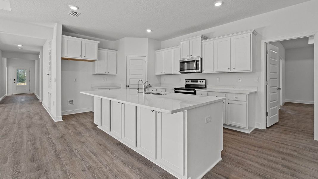 Representative furnished interior of a home built from the Camden by D.R. Horton in Owl's Head Farms, Freeport (Image 4).