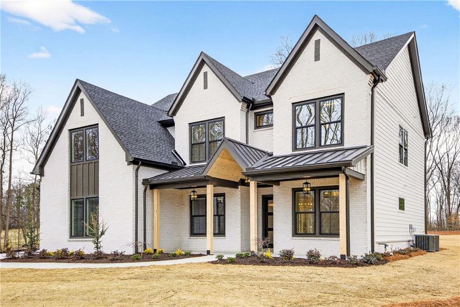 Front exterior of a new home in , Cumming, GA, highlighting curb appeal (Image 27).