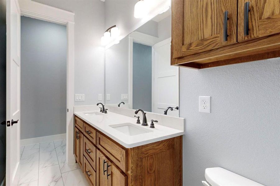 Bathroom with vanity and toilet