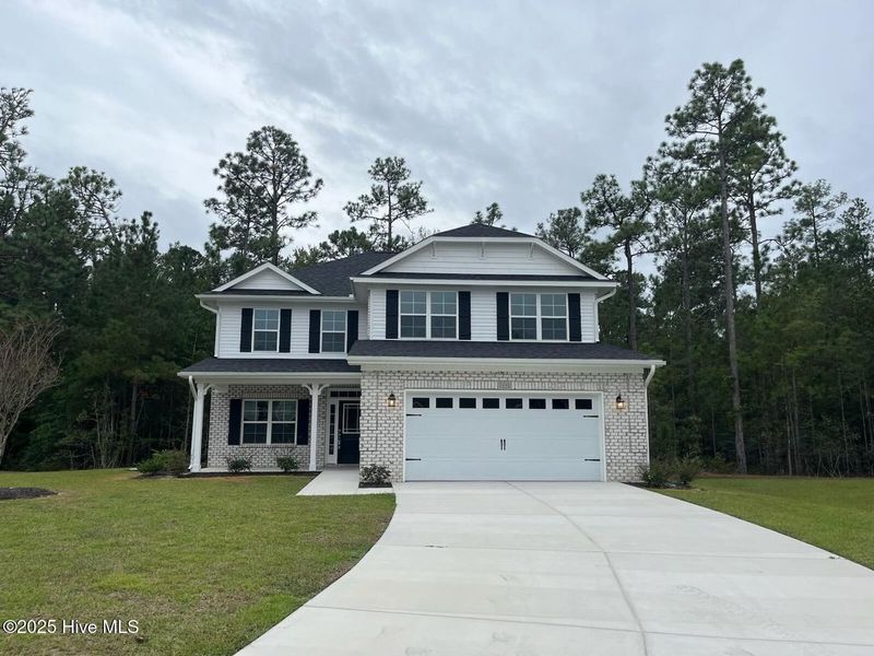Front exterior of a new home in Palmetto Creek, Bolivia, NC, highlighting curb appeal (Image 2).