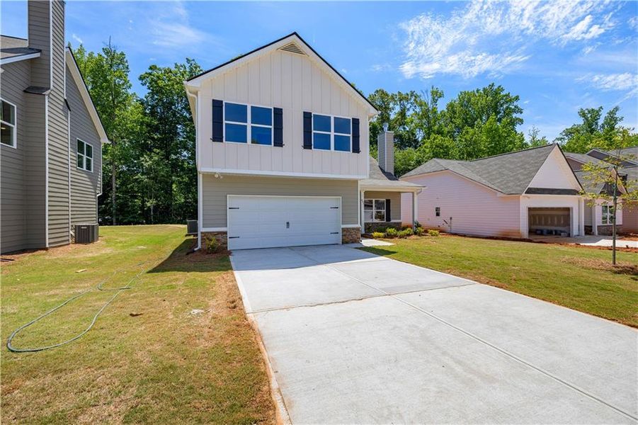 Front exterior of a new home in , Villa Rica, GA, highlighting curb appeal (Image 2). Front exterior of a new home in , Villa Rica, GA, highlighting curb appeal (Image 2).