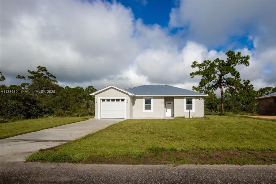 Front exterior of a new home in , Lake Placid, FL, highlighting curb appeal (Image 22).
