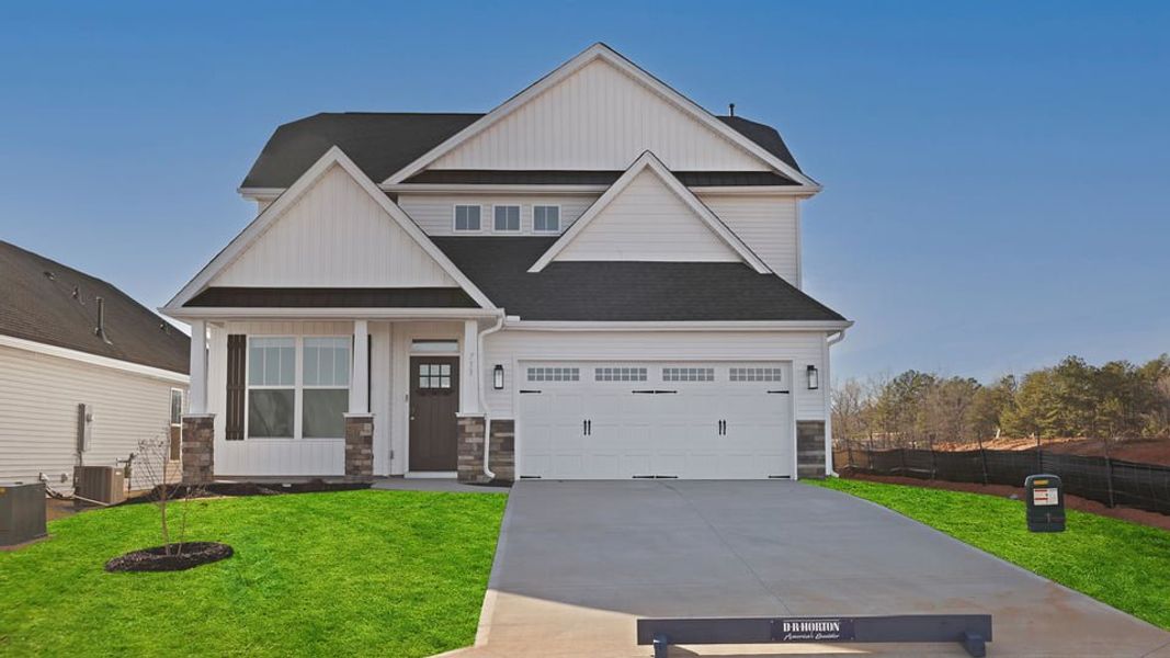 Front exterior of a new home in Village 3, Woodruff, SC, highlighting curb appeal (Image 1). Front exterior of a new home in Village 3, Woodruff, SC, highlighting curb appeal (Image 1).