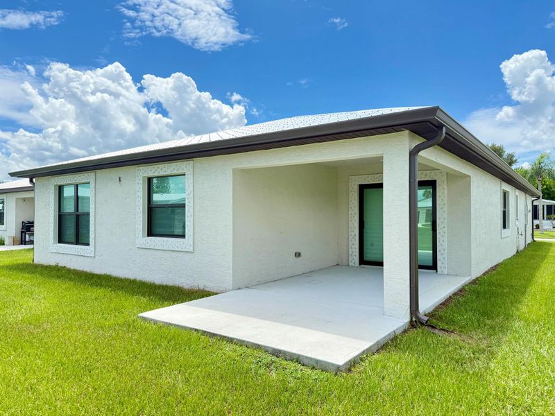Front exterior of a new home in , Fort Pierce, FL, highlighting curb appeal (Image 26).