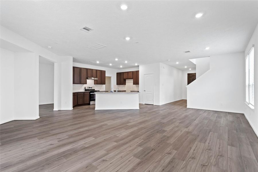 Thoughtfully designed with an open layout, the family room offers clear sightlines to the entryway, ensuring you remain effortlessly connected to guests and family the moment they step through the front door. Thoughtfully designed with an open layout, the family room offers clear sightlines to the entryway, ensuring you remain effortlessly connected to guests and family the moment they step through the front door.