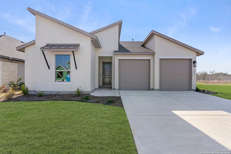 Front exterior of a new home in Nolte Farms, Seguin, TX, highlighting curb appeal (Image 21). Front exterior of a new home in Nolte Farms, Seguin, TX, highlighting curb appeal (Image 21).