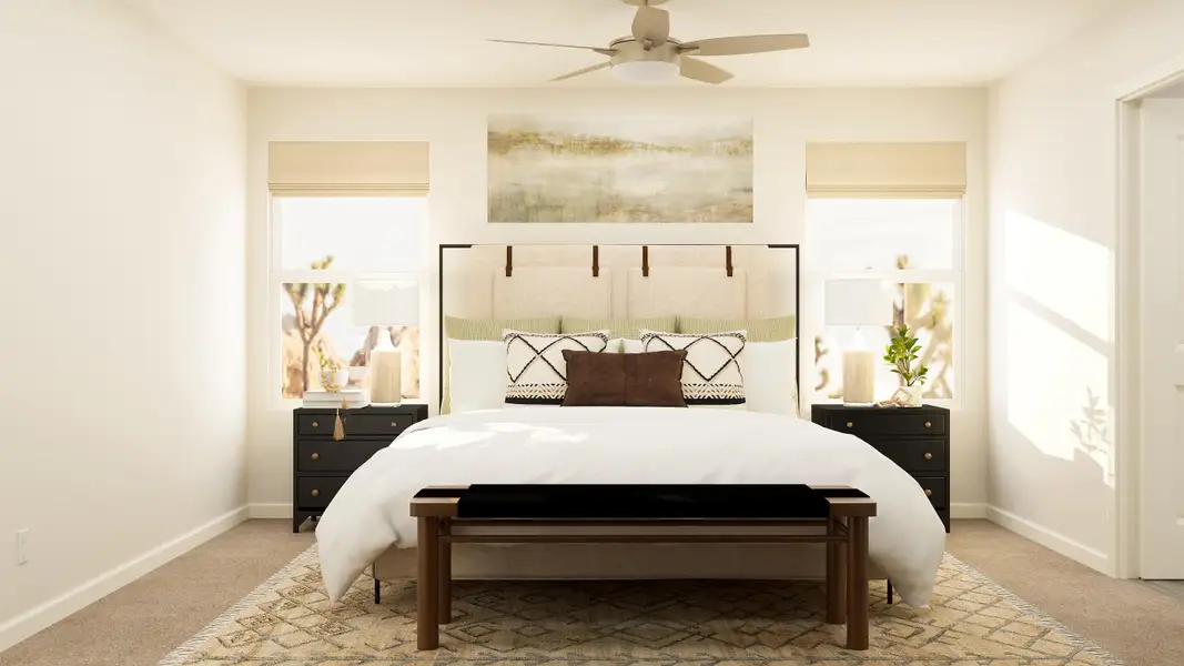 A bedroom with a bed and a fan.