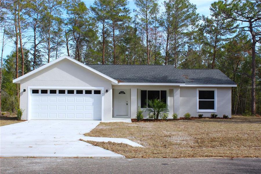 Front exterior of a new home in , Ocklawaha, FL, highlighting curb appeal (Image 21).