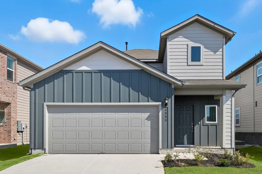 Front exterior of a new home in Longview 40s, Del Valle, TX, highlighting curb appeal (Image 1).