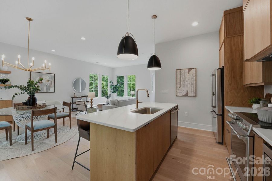 Custom white oak cabinetry with GE Cafe Series appliances