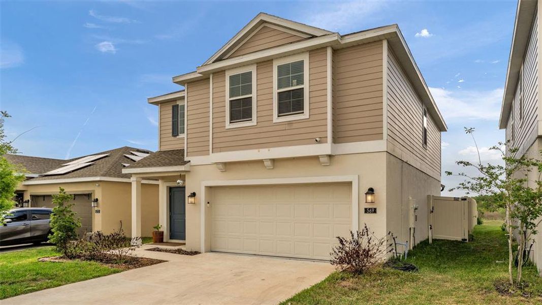 Front exterior of a new home in , Winter Haven, FL, highlighting curb appeal (Image 25).