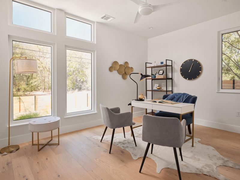 Home office featuring light wood-type flooring and ceiling fan Home office featuring light wood-type flooring and ceiling fan