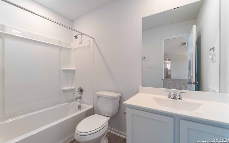 Furnished interior view inside a new home in Hennersby Hollow, San Antonio (Image 2). Furnished interior view inside a new home in Hennersby Hollow, San Antonio (Image 2).