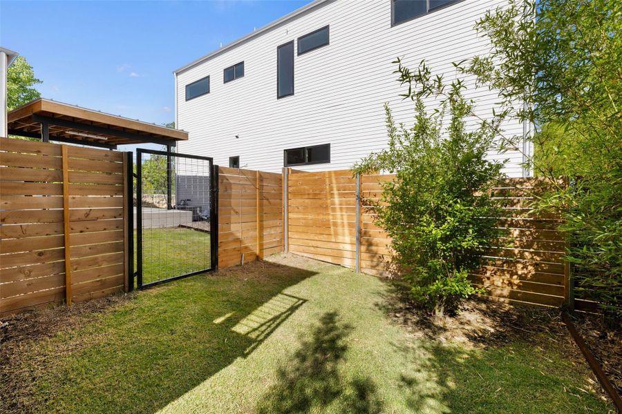 View of yard featuring a gate