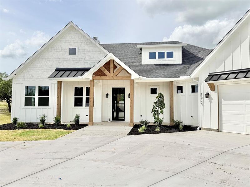 Front exterior of a new home in , Weatherford, TX, highlighting curb appeal (Image 27).