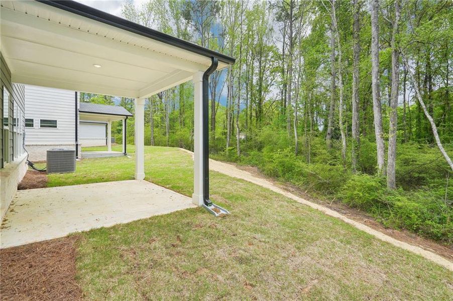 Front exterior of a new home in Westmont Preserve, Powder Springs, GA, highlighting curb appeal (Image 2). Front exterior of a new home in Westmont Preserve, Powder Springs, GA, highlighting curb appeal (Image 2).