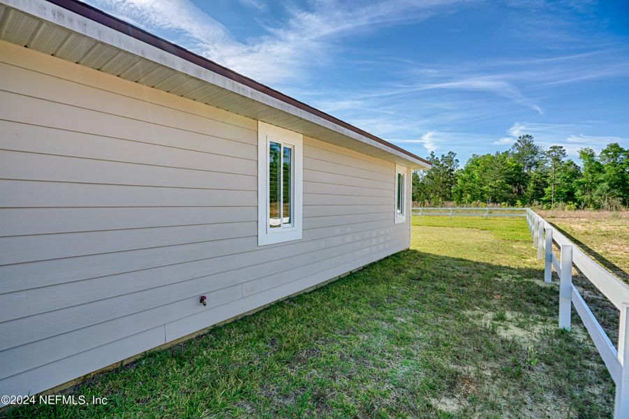 Exterior details and patio area of a home in , Hawthorne (Image 3). Exterior details and patio area of a home in , Hawthorne (Image 3).