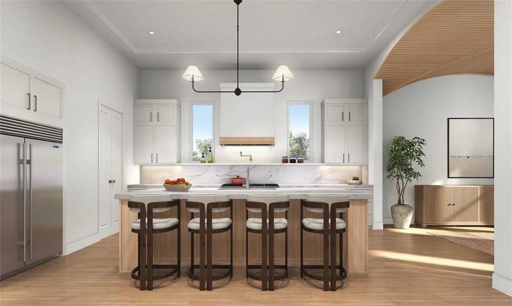 This spacious open-concept kitchen features stainless-steel appliances and quartz countertops.