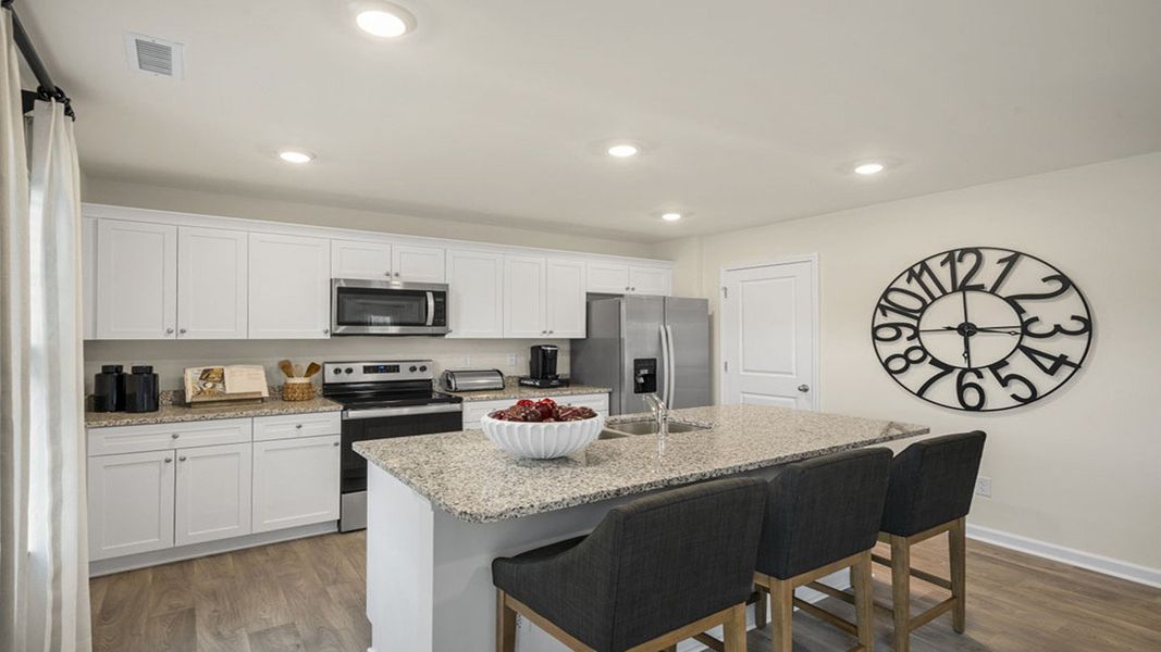 Representative furnished interior of a home built from the GALEN by D.R. Horton in English Farm, Archdale (Image 30).