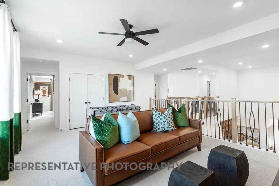 Living area with ceiling fan, light carpet, and recessed lighting Living area with ceiling fan, light carpet, and recessed lighting