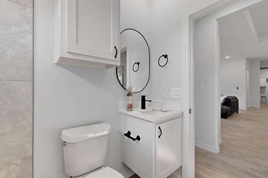 Bathroom featuring vanity and light wood-style floors Bathroom featuring vanity and light wood-style floors