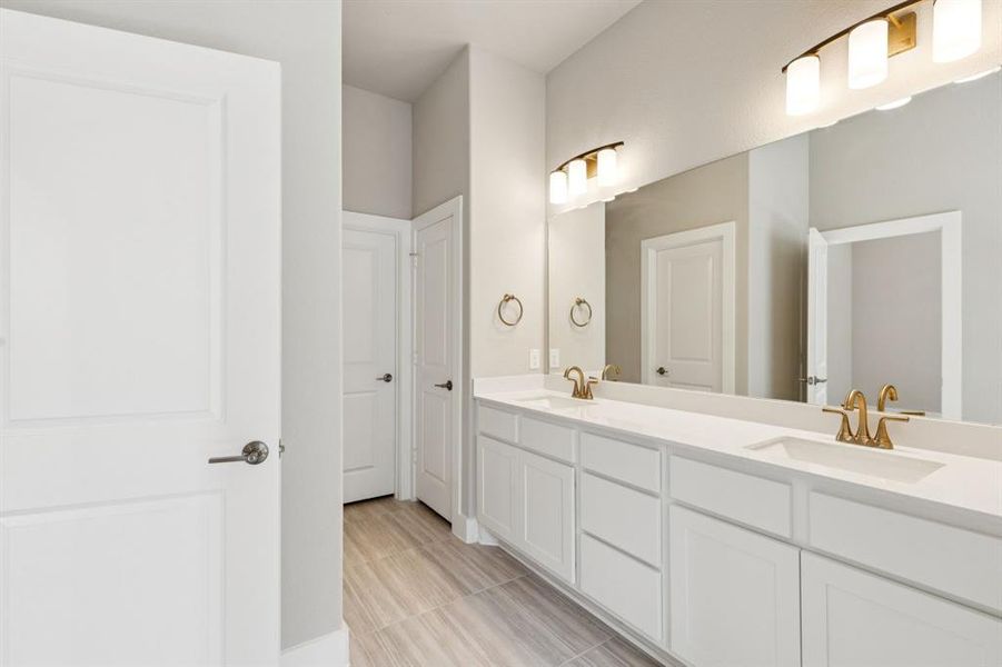 Bathroom featuring double vanity