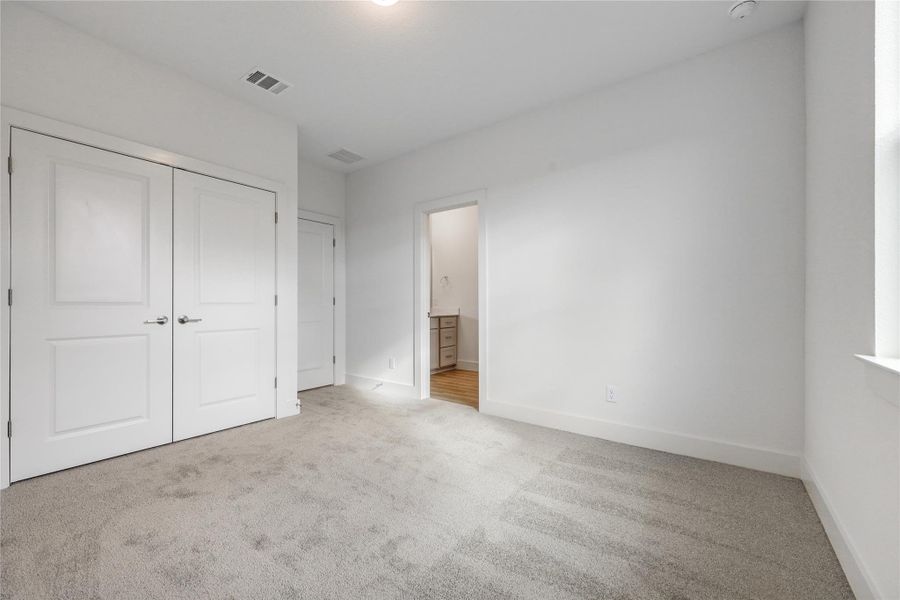 Secondary bedroom: 1 of 2.