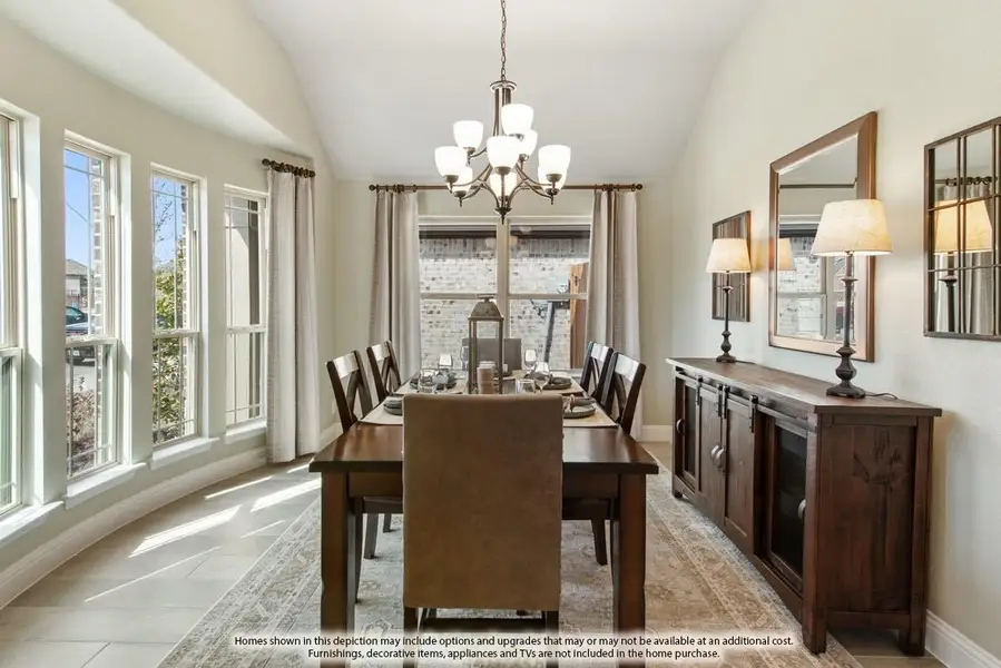Dining room with dark wood table, six chairs, chandelier, and large windows with natural light