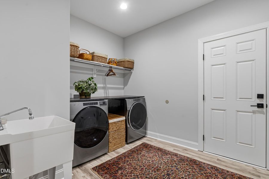 Large laundry room with utility sink!