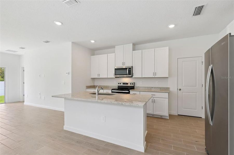 Furnished interior view inside a new home in Flagler Village - Classic Series, Palm Coast (Image 9).
