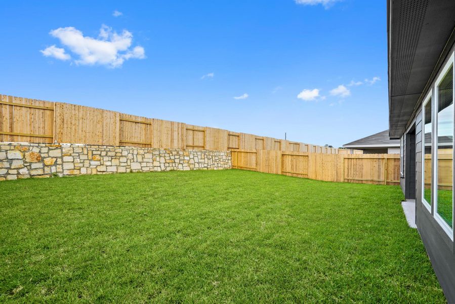 Exterior details and patio area of a home in Grand Pines, Magnolia (Image 4).