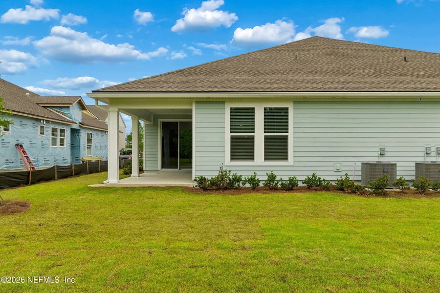 Exterior details and patio area of a home in Westerly Park at Wildlight – Villa Collection, Yulee (Image 17). Exterior details and patio area of a home in Westerly Park at Wildlight – Villa Collection, Yulee (Image 17).