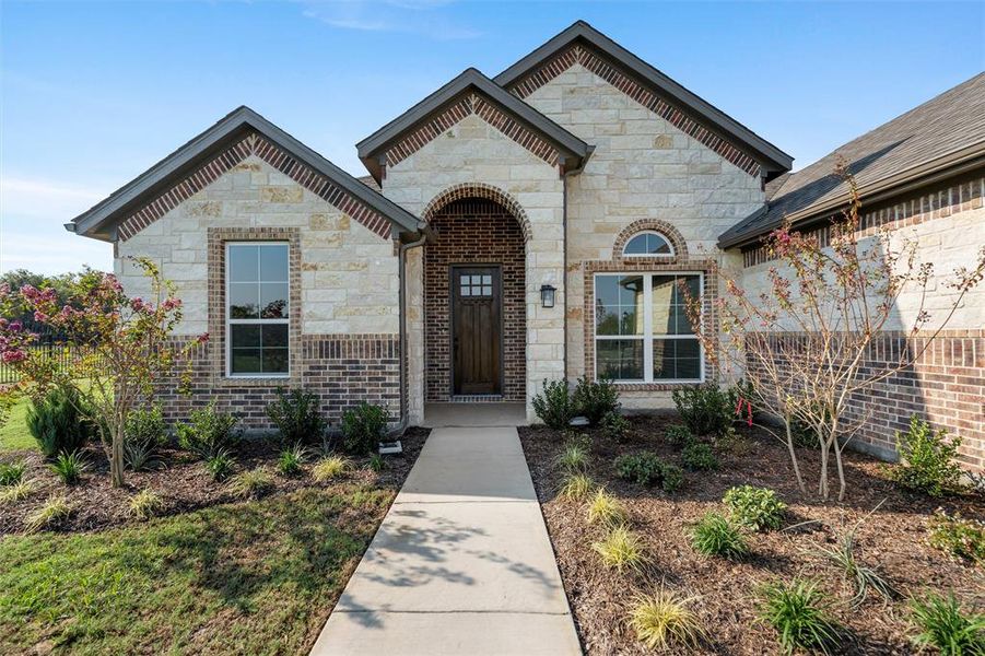 Front exterior of a new home in Vista Oaks Estates, Royse City, TX, highlighting curb appeal (Image 21).