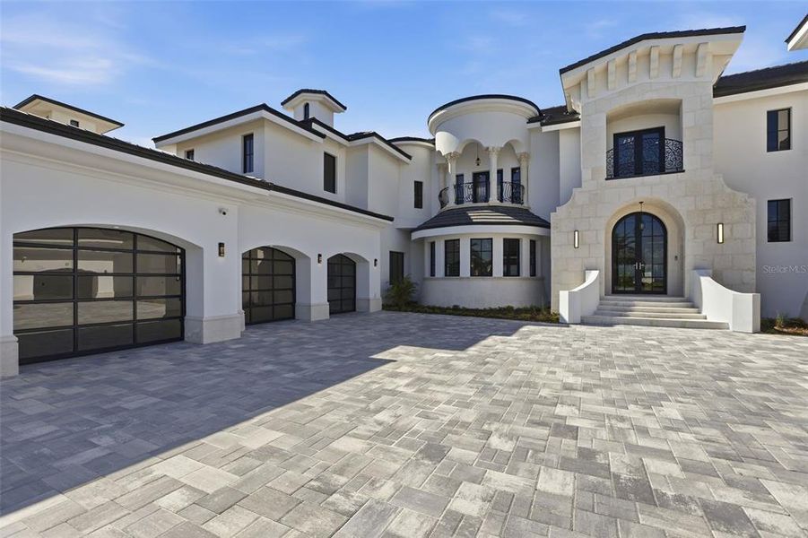 Front exterior of a new home in , Windermere, FL, highlighting curb appeal (Image 2). Front exterior of a new home in , Windermere, FL, highlighting curb appeal (Image 2).