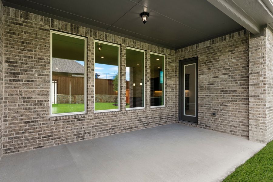 Exterior details and patio area of a home in Nelson Lake Estates, Rockwall (Image 22).