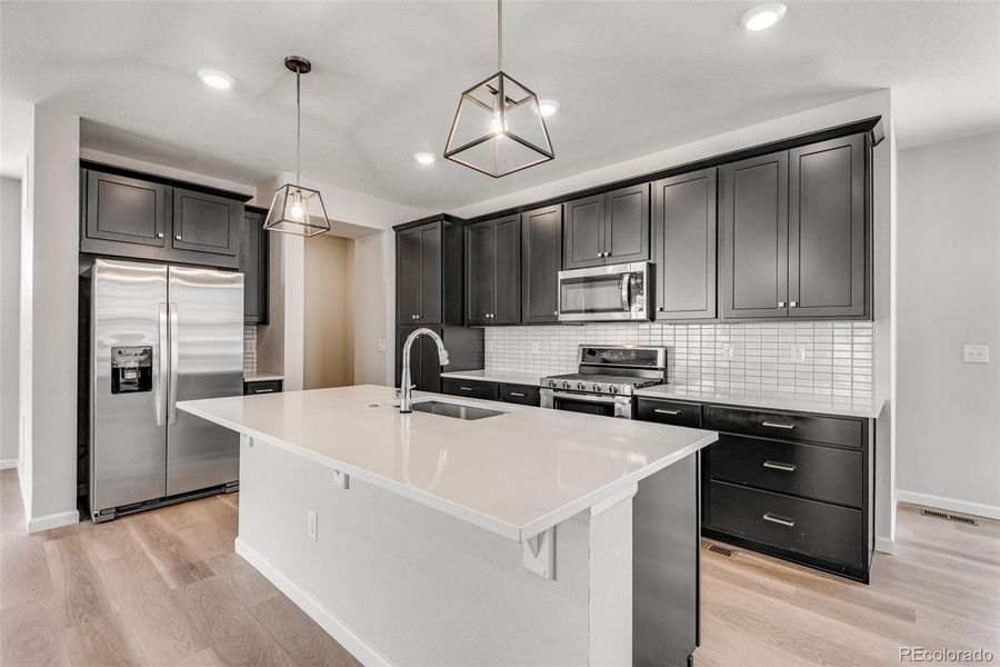 Furnished interior view inside a new home in Crescendo at The Aurora Highlands, Aurora (Image 4).