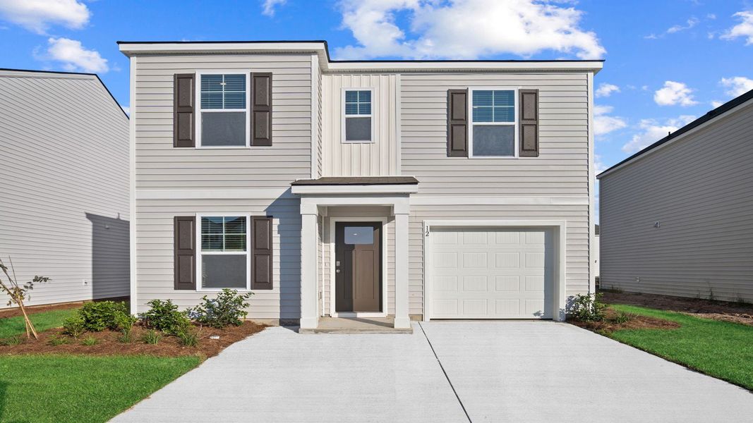 Front exterior of a new home in Rice Hope, Port Wentworth, GA, highlighting curb appeal (Image 1).