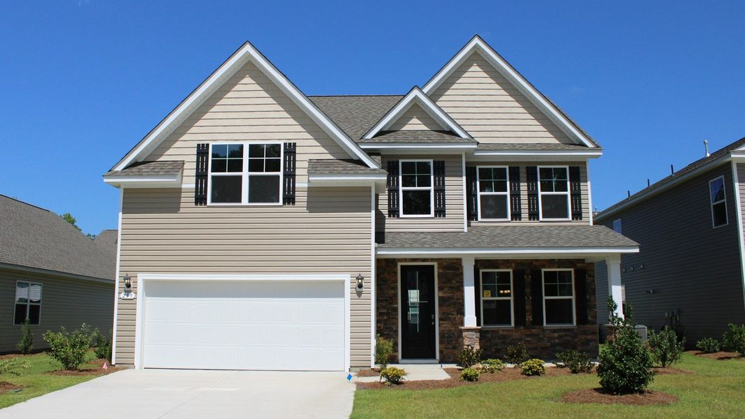 Representative exterior photo of a completed home built from the Forrester by D.R. Horton in The Bluffs at Mill Creek, Florence, SC (Image 24).