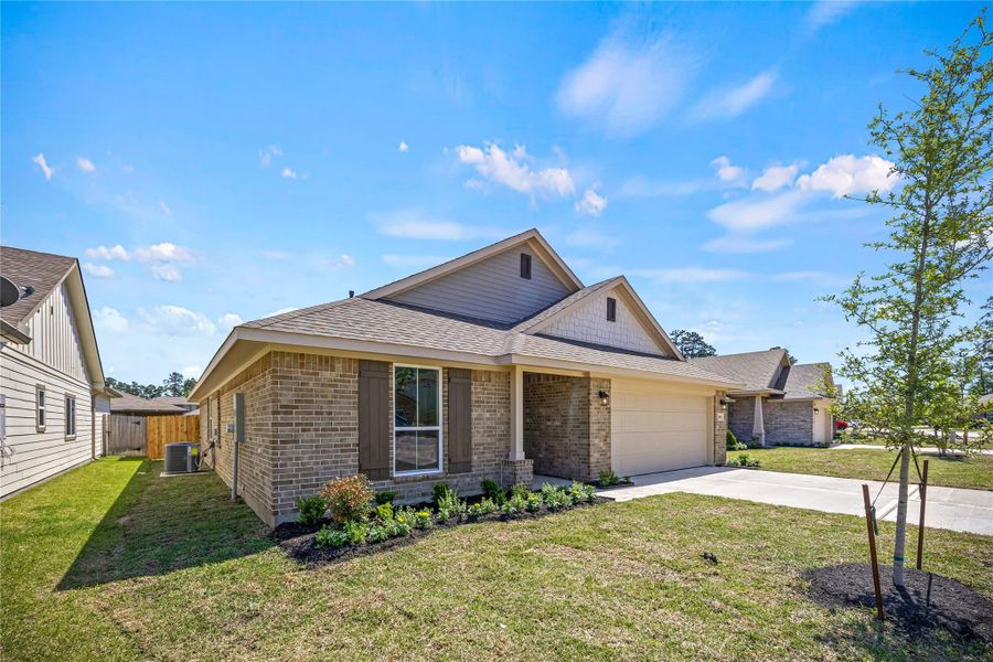 Front exterior of a new home in Grand Oaks Reserve, Cleveland, TX, highlighting curb appeal (Image 2).